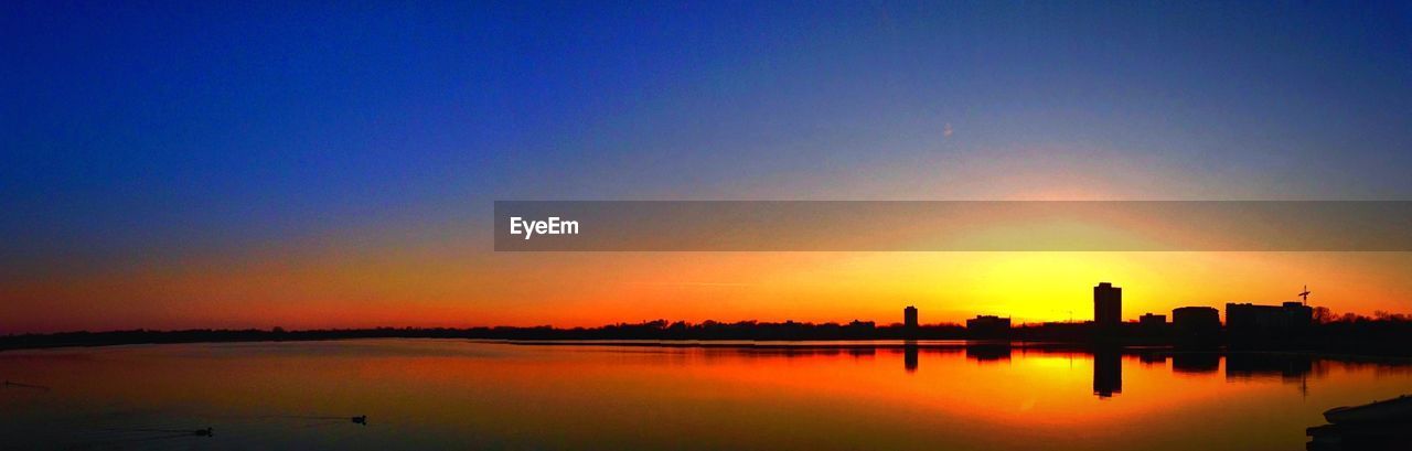 Scenic view of lake calhoun against clear sky during sunset