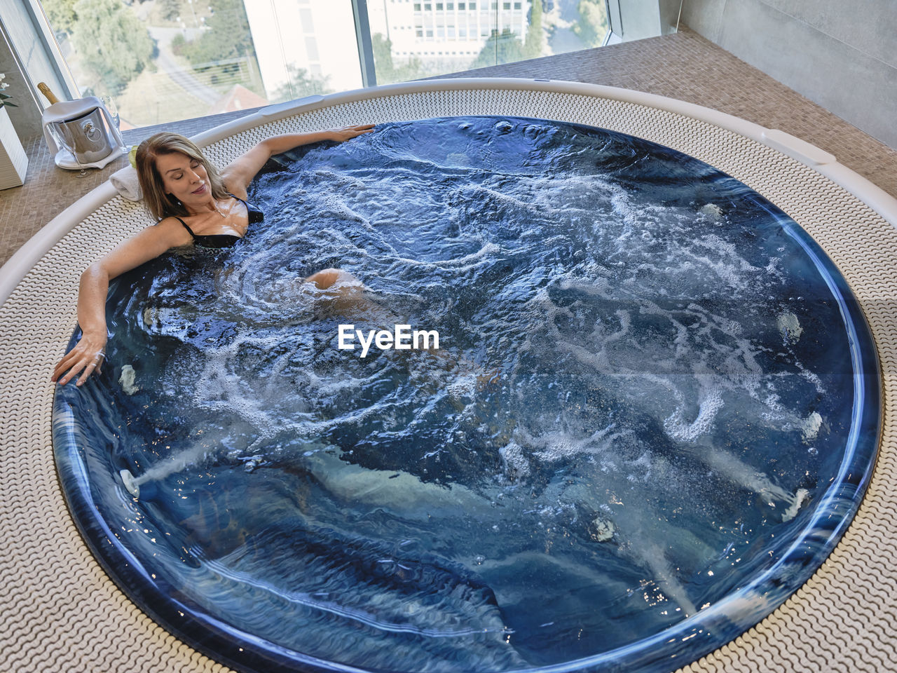 High angle view of senior woman in swimming pool