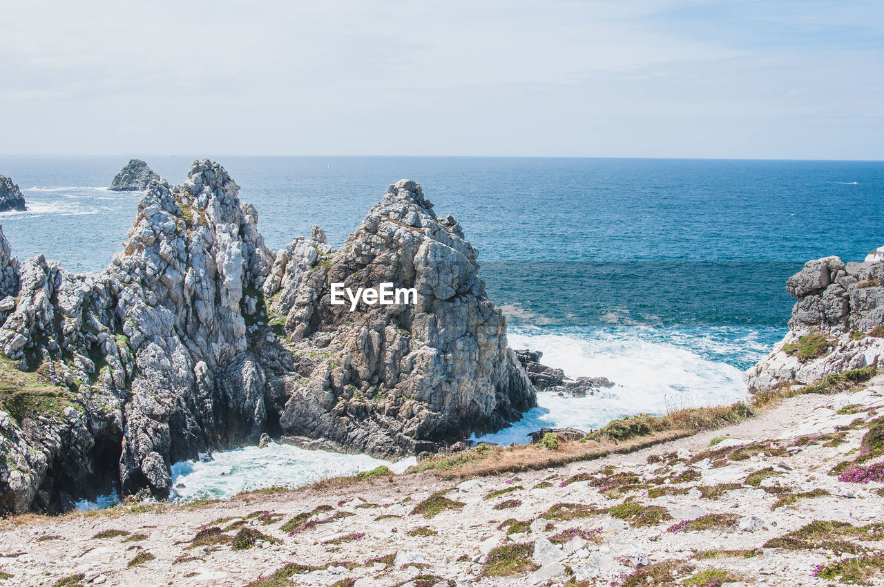 PANORAMIC VIEW OF BEACH AGAINST SKY