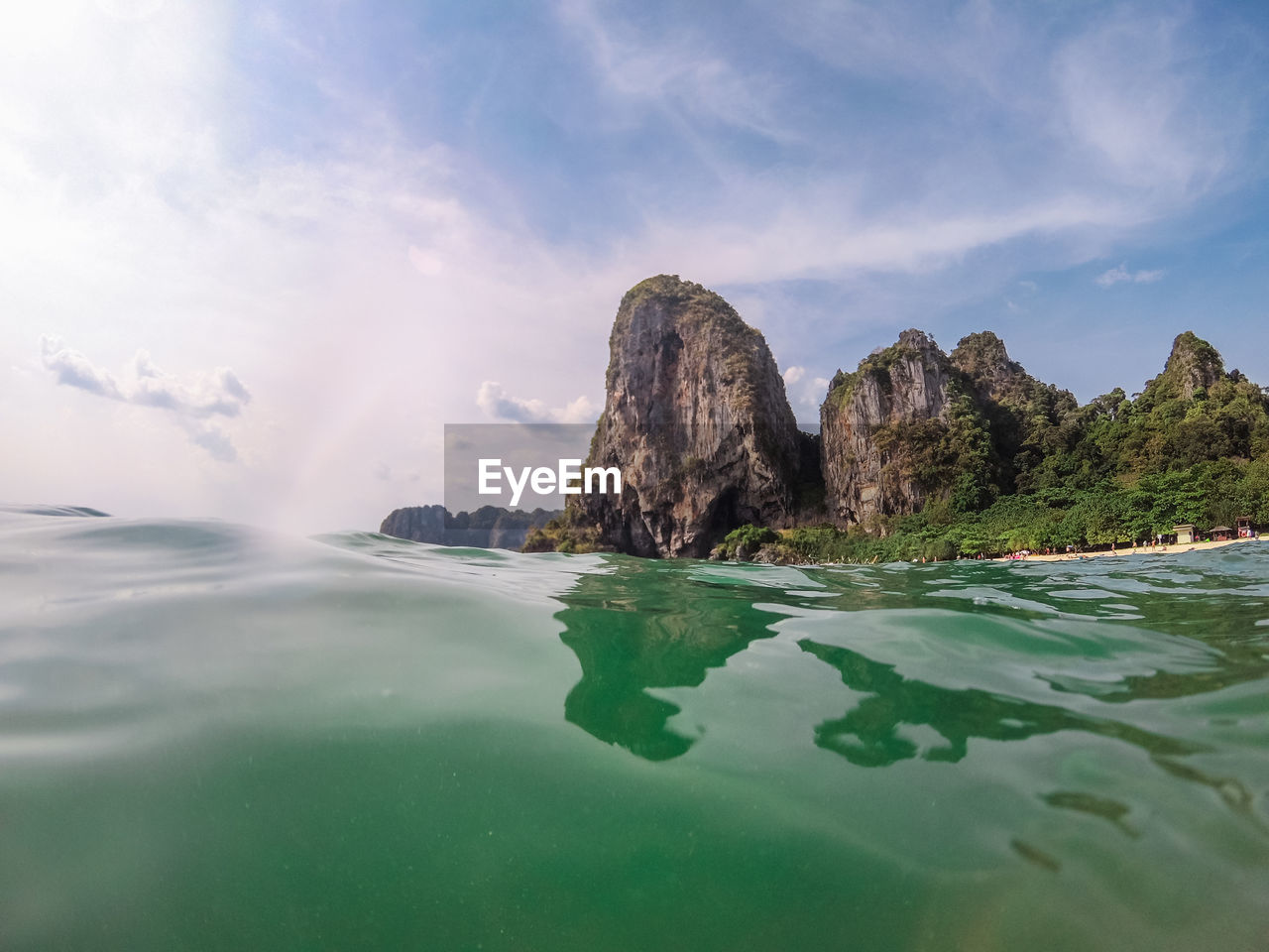 SCENIC VIEW OF ROCK FORMATION IN SEA AGAINST SKY