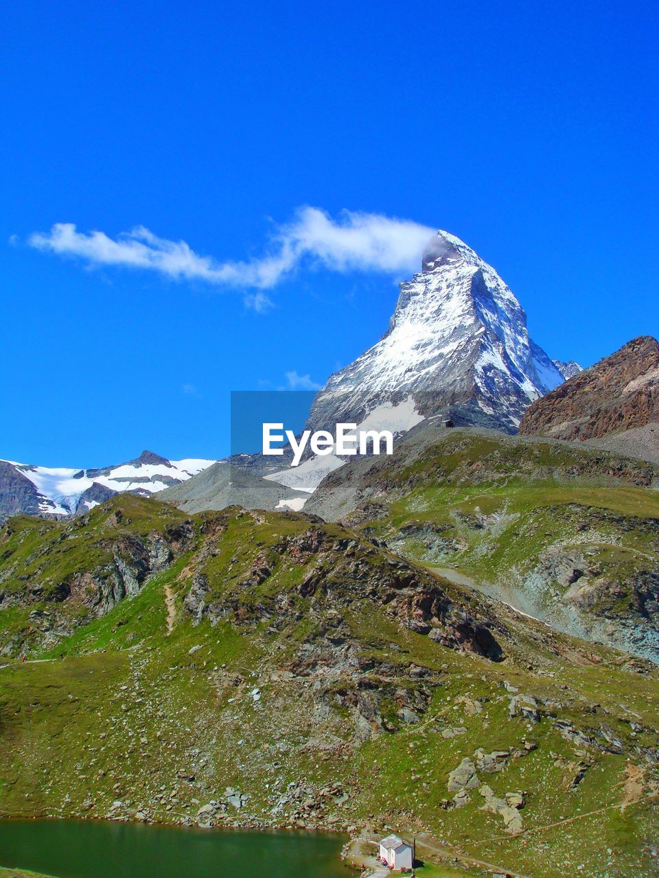 Scenic view of mountains against cloudy sky