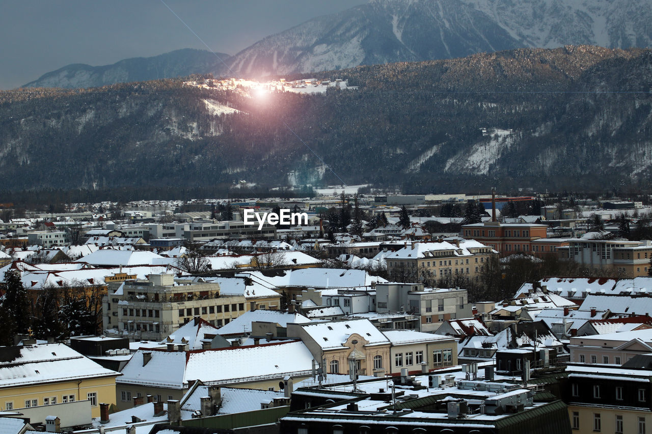 High angle view of snowcapped mountains against sky during winter