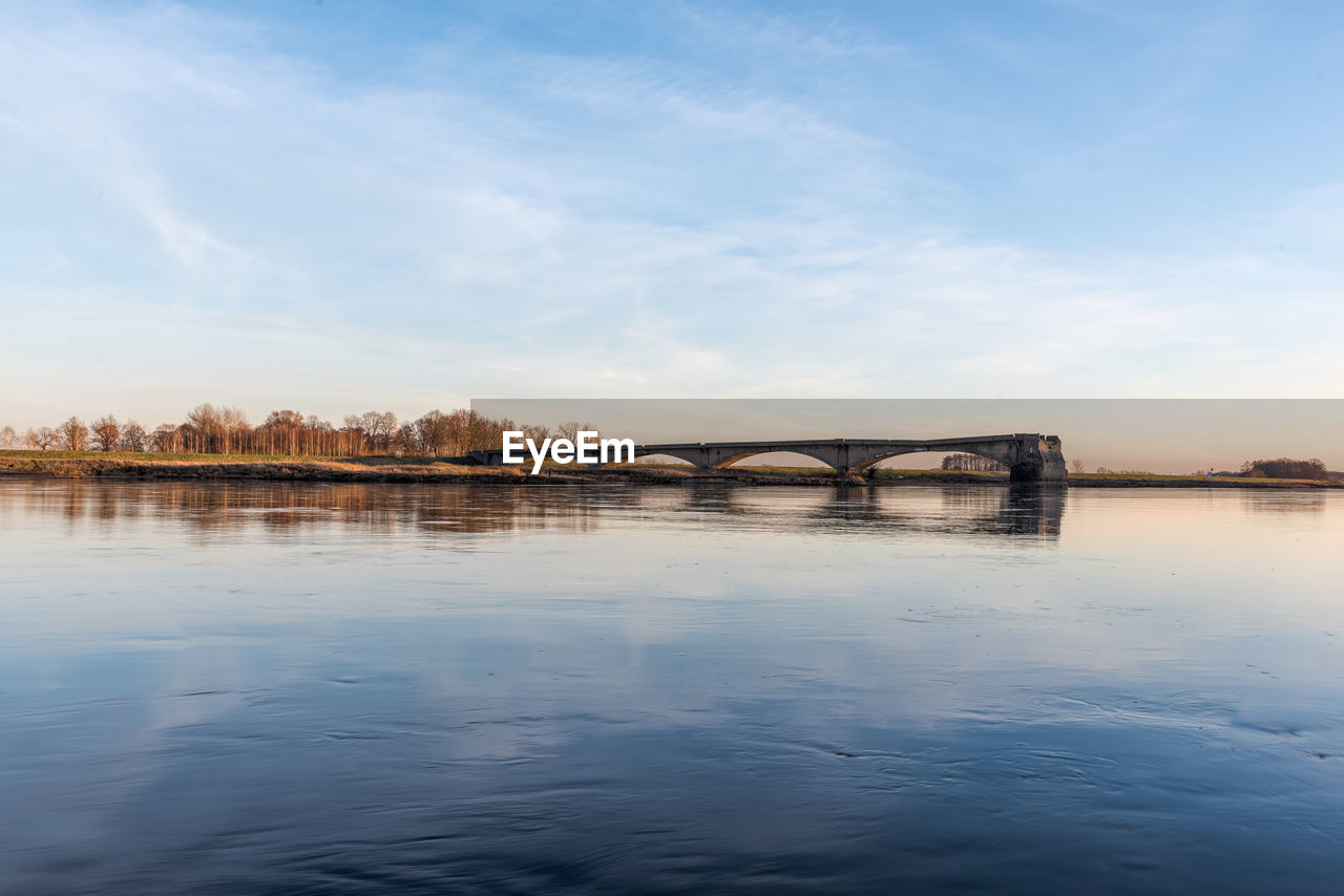 Bridge over river against sky