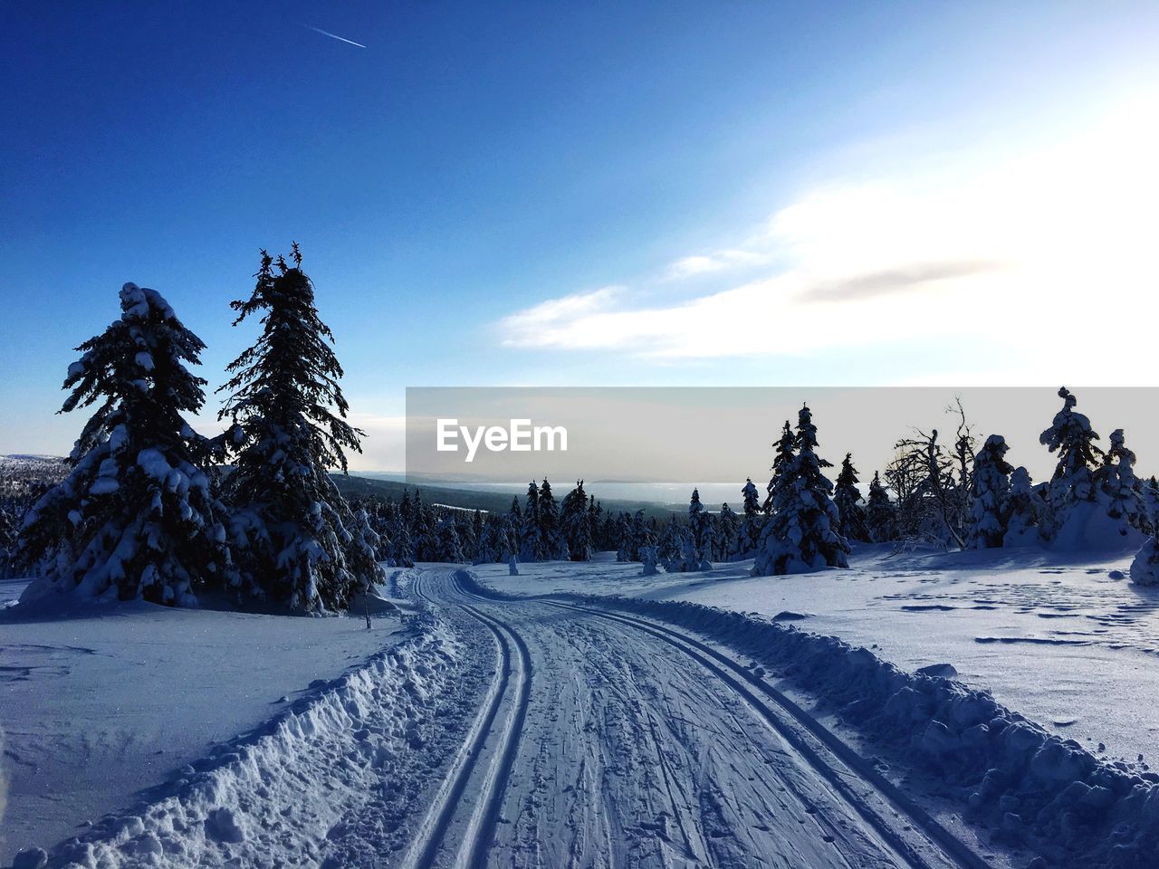 SNOW COVERED LANDSCAPE AGAINST SKY