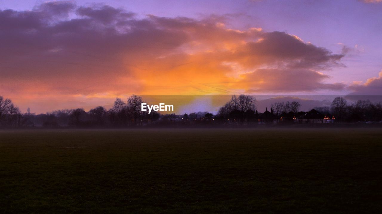 Scenic view of landscape against sky during sunset