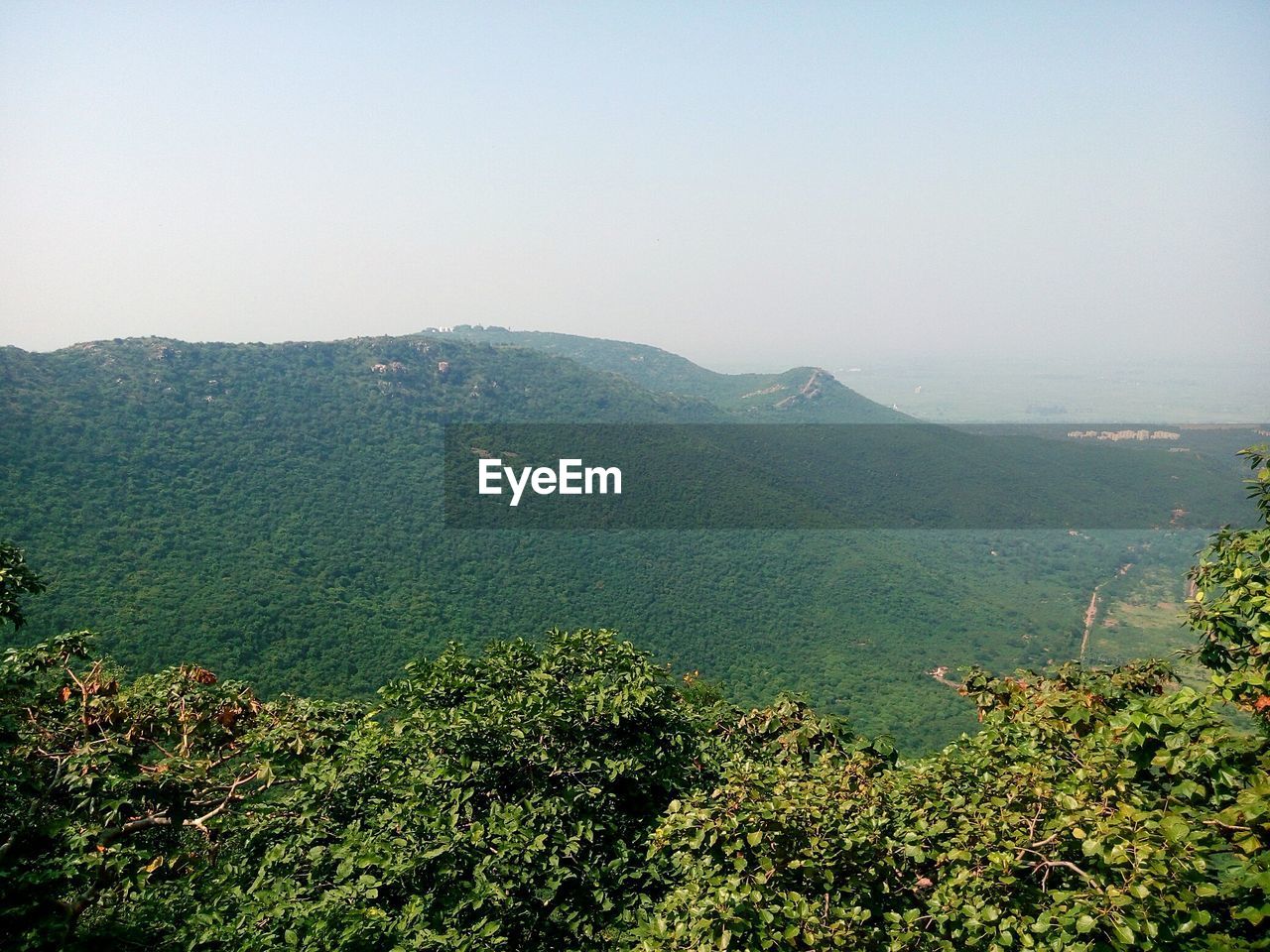 SCENIC VIEW OF MOUNTAIN AGAINST CLEAR SKY