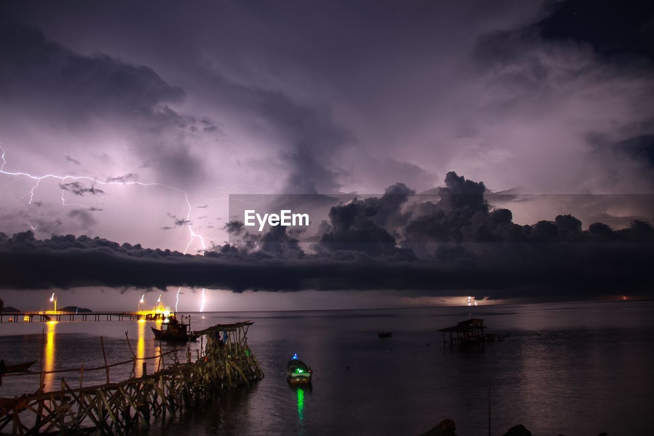 Scenic view of sea against sky at night