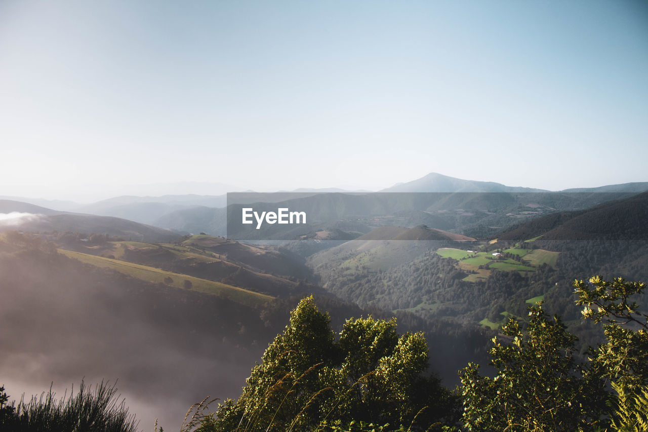 Overhead view of mountains landscape with fog above