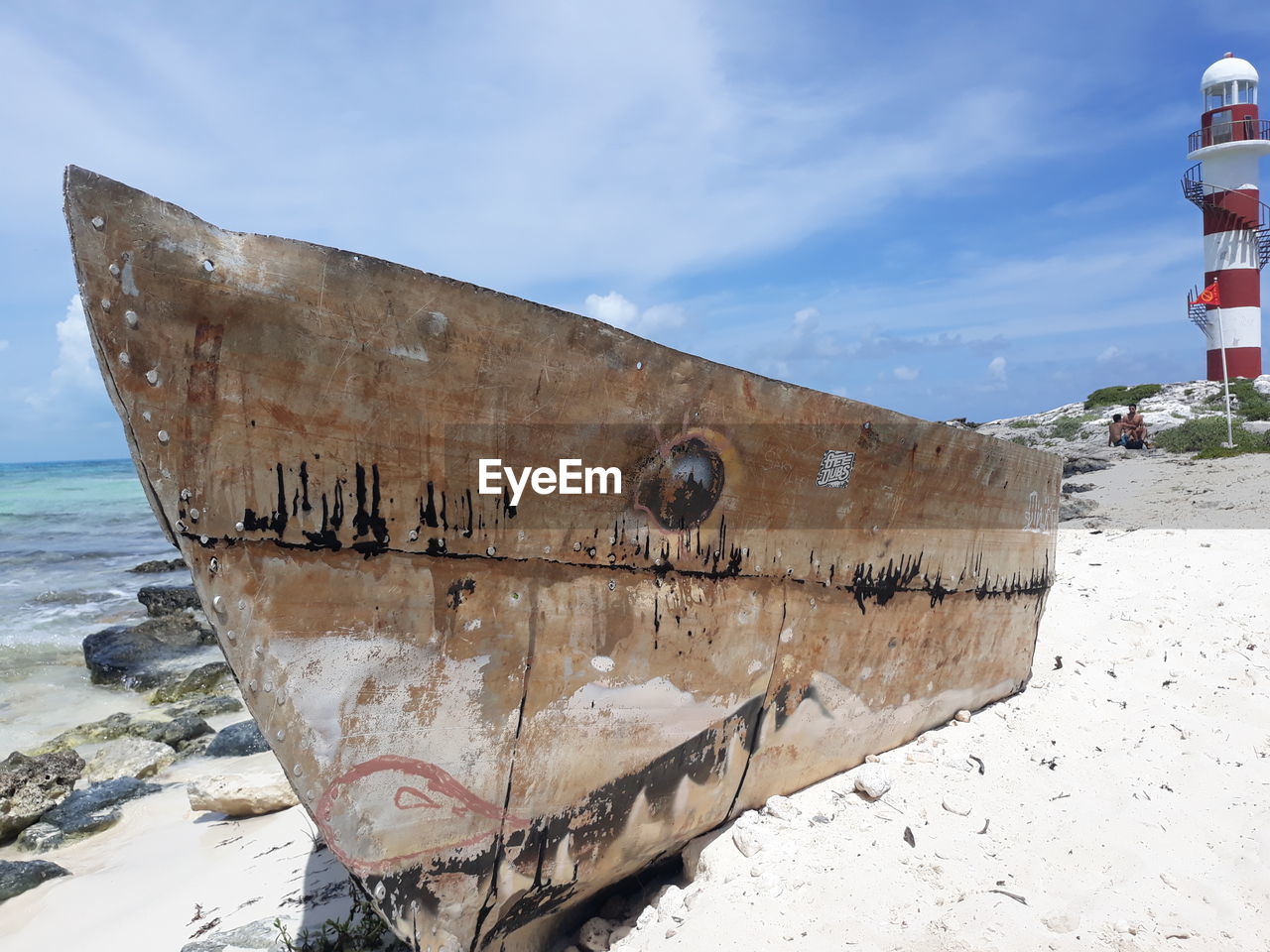 ABANDONED BOAT ON BEACH