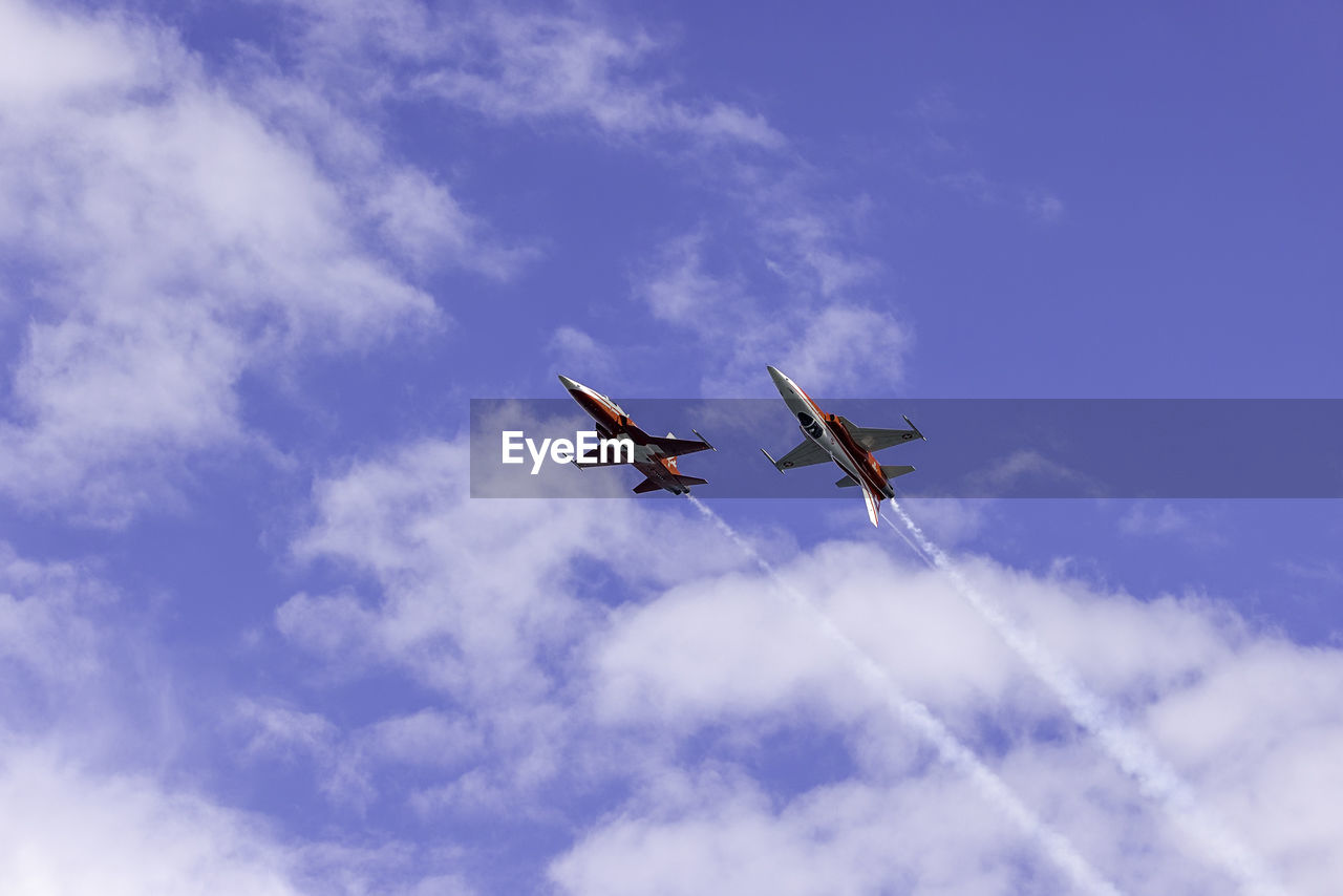 sky, cloud, flying, air vehicle, airplane, transportation, mode of transportation, on the move, air show, low angle view, blue, nature, aviation, air force, aerobatics, aircraft, wing, vehicle, motion, mid-air, no people, day, plane, fighter plane, outdoors, travel, military, teamwork, cooperation, general aviation, military airplane