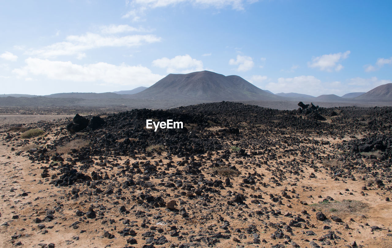 Scenic view of volcanic landscape against sky