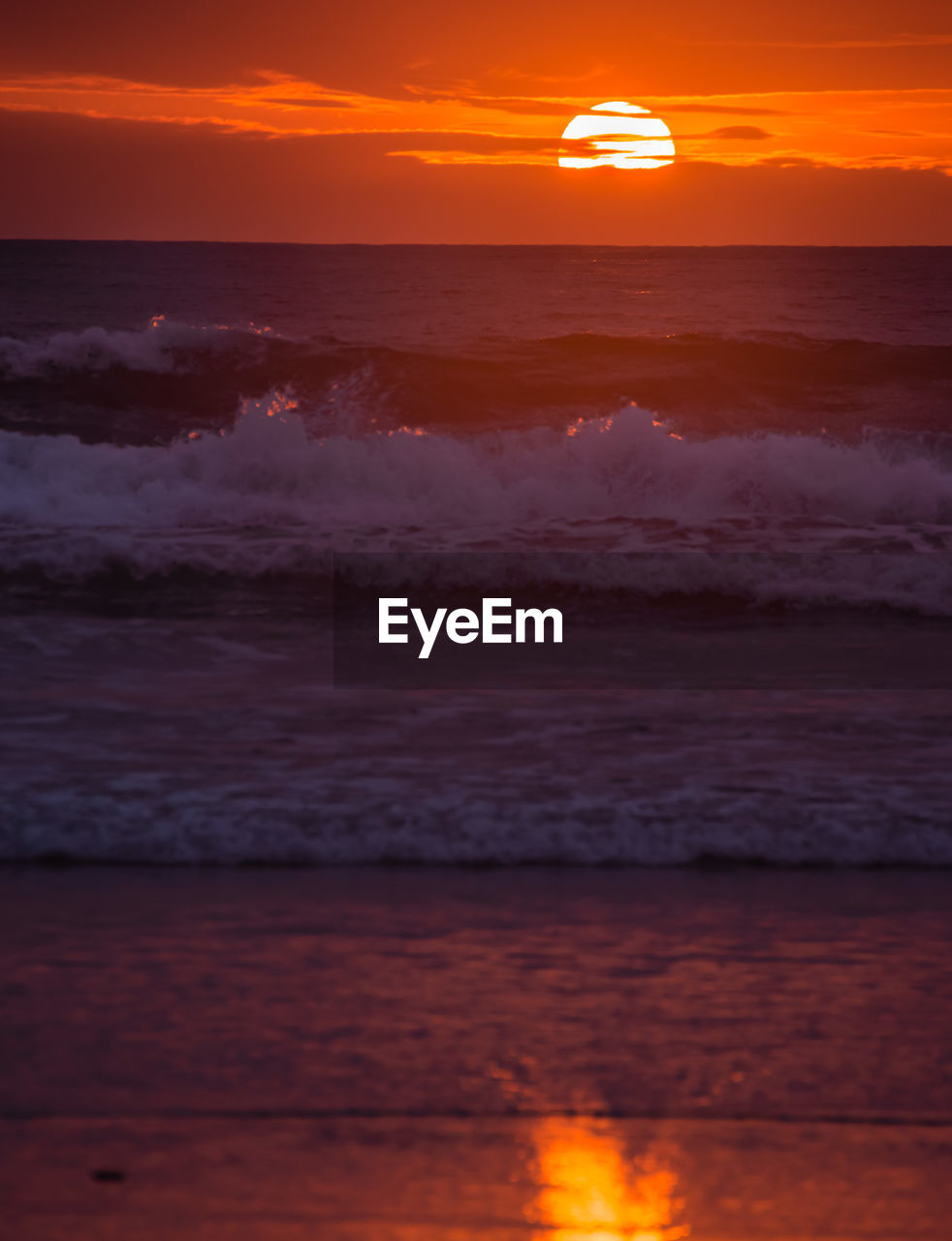 SCENIC VIEW OF BEACH DURING SUNSET