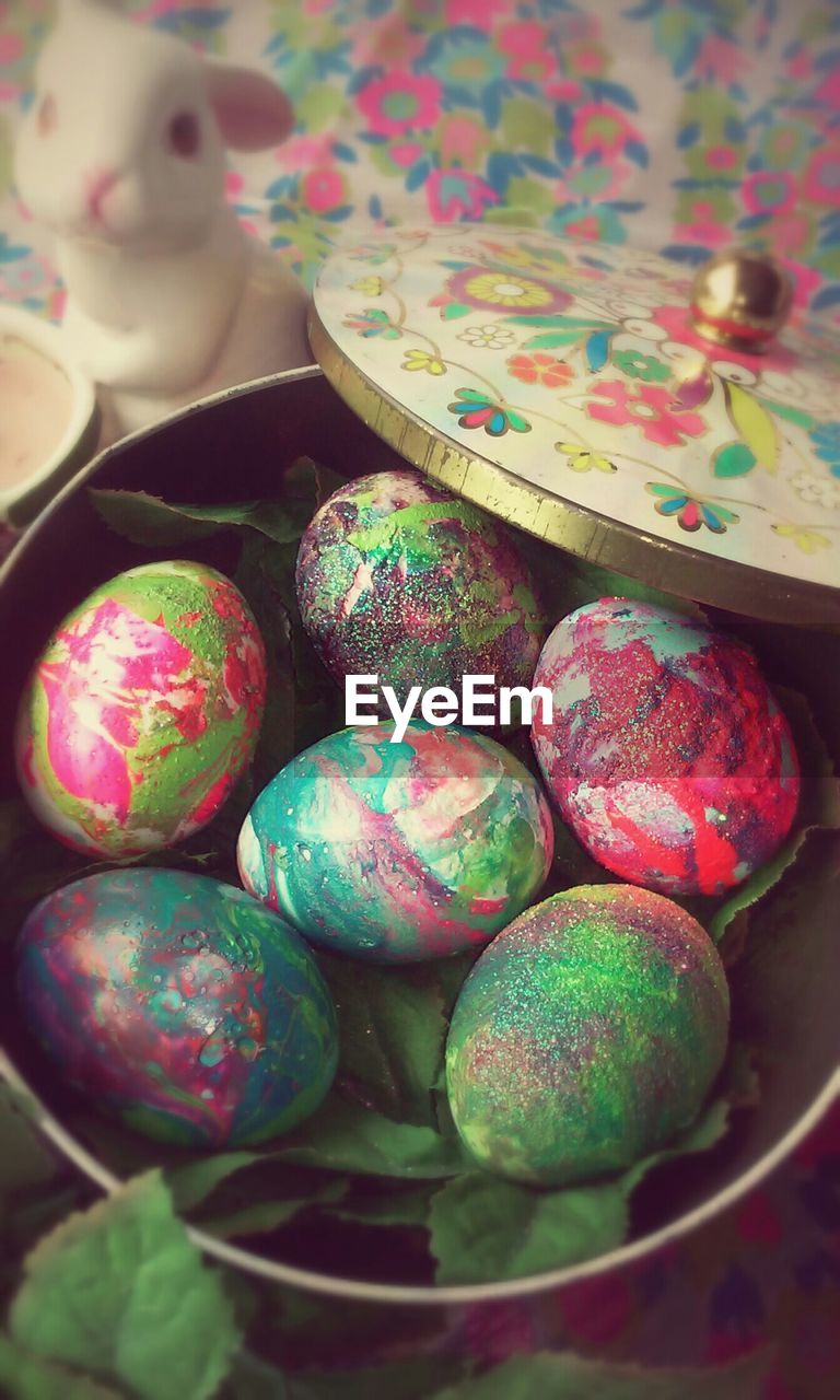 High angle view of easter eggs in container on table at home