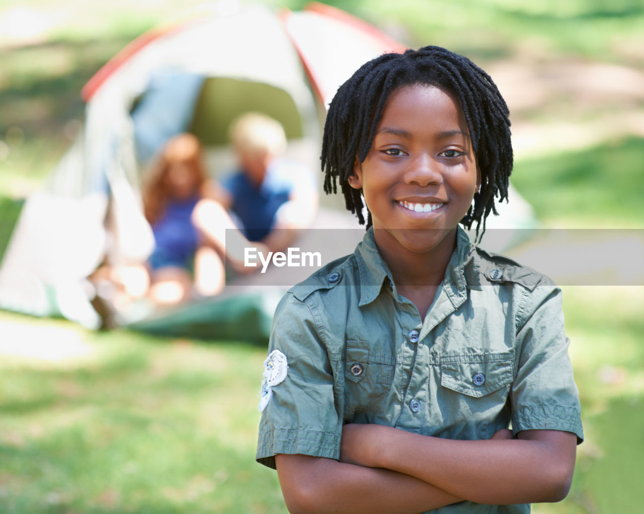 smiling, happiness, emotion, portrait, women, looking at camera, adult, cheerful, person, child, female, human face, nature, childhood, positive emotion, lifestyles, grass, summer, enjoyment, clothing, relaxation, teenager, one person, cute, camping, outdoors, young adult, casual clothing, smile, friendship, teeth, day, men, park - man made space, leisure activity, park, tent, fashion accessory, focus on foreground, plant