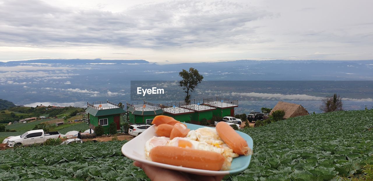 VIEW OF FOOD ON TABLE AGAINST SKY