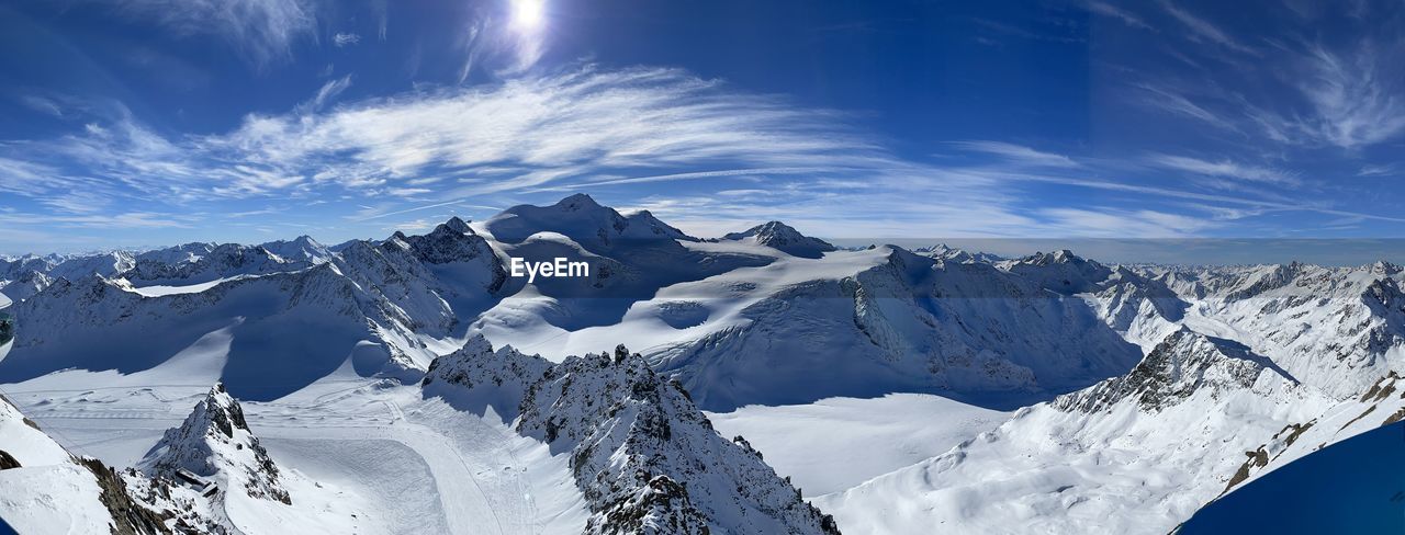 SNOW COVERED MOUNTAIN AGAINST SKY