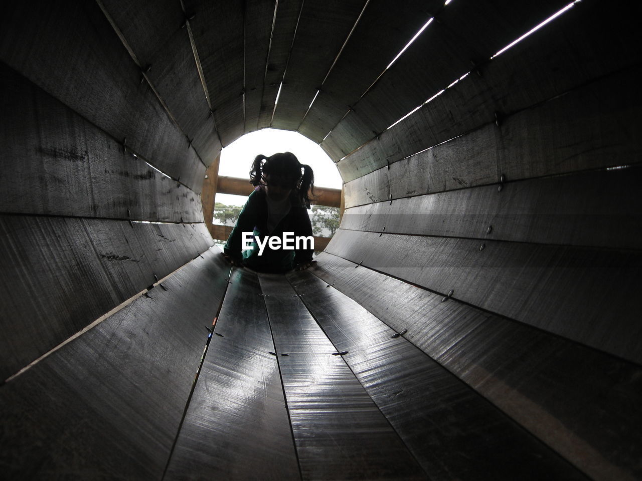 Girl in tube slide