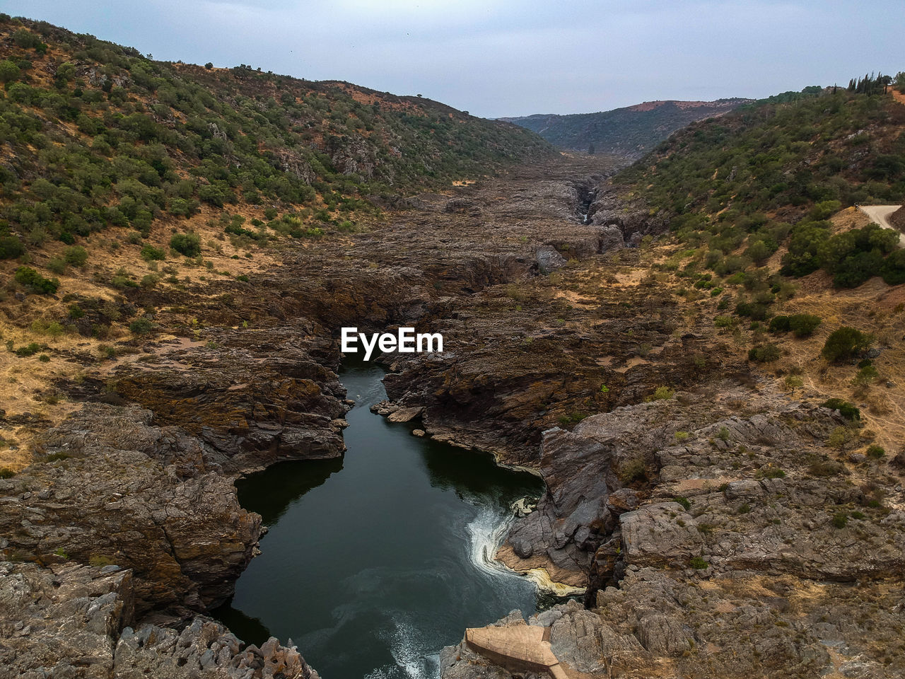 Scenic view of rock formations against sky