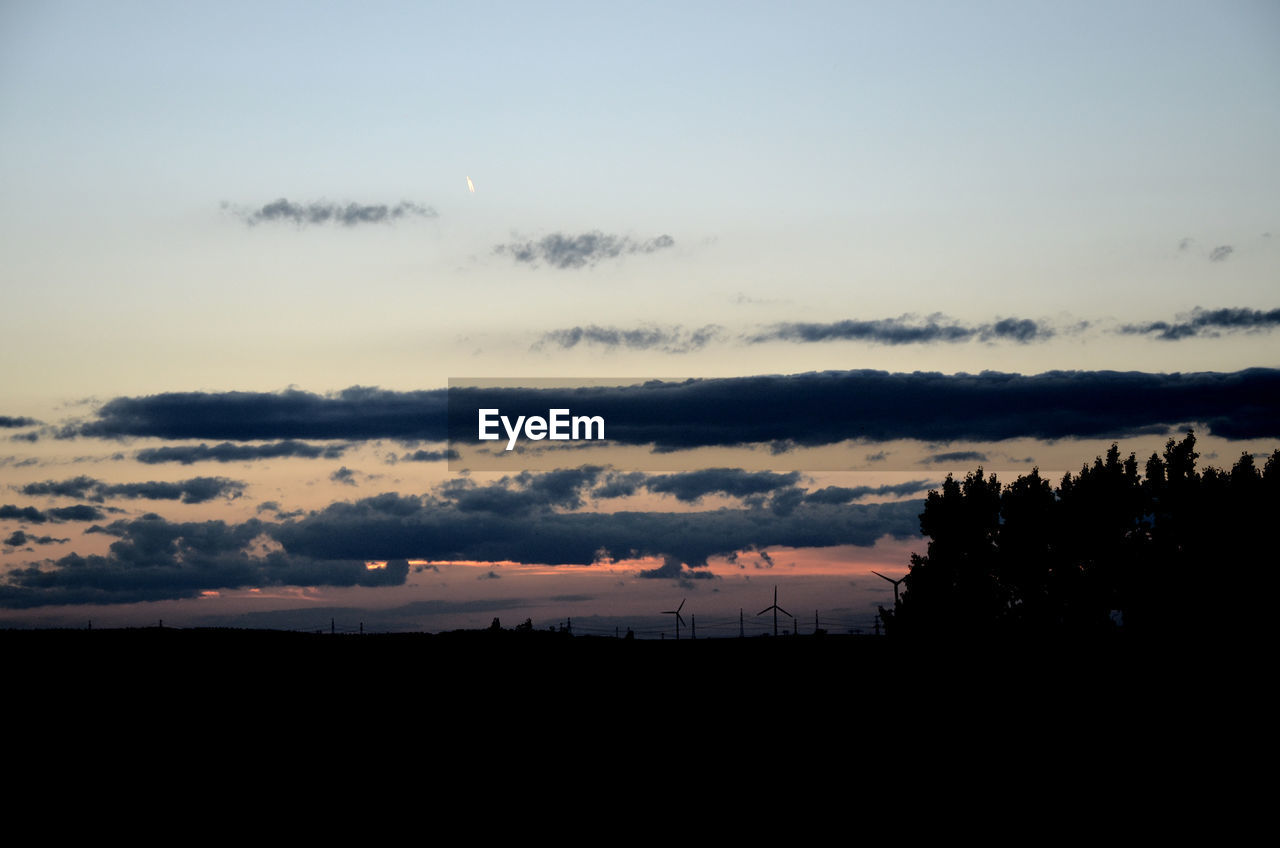 SILHOUETTE OF LANDSCAPE AT SUNSET