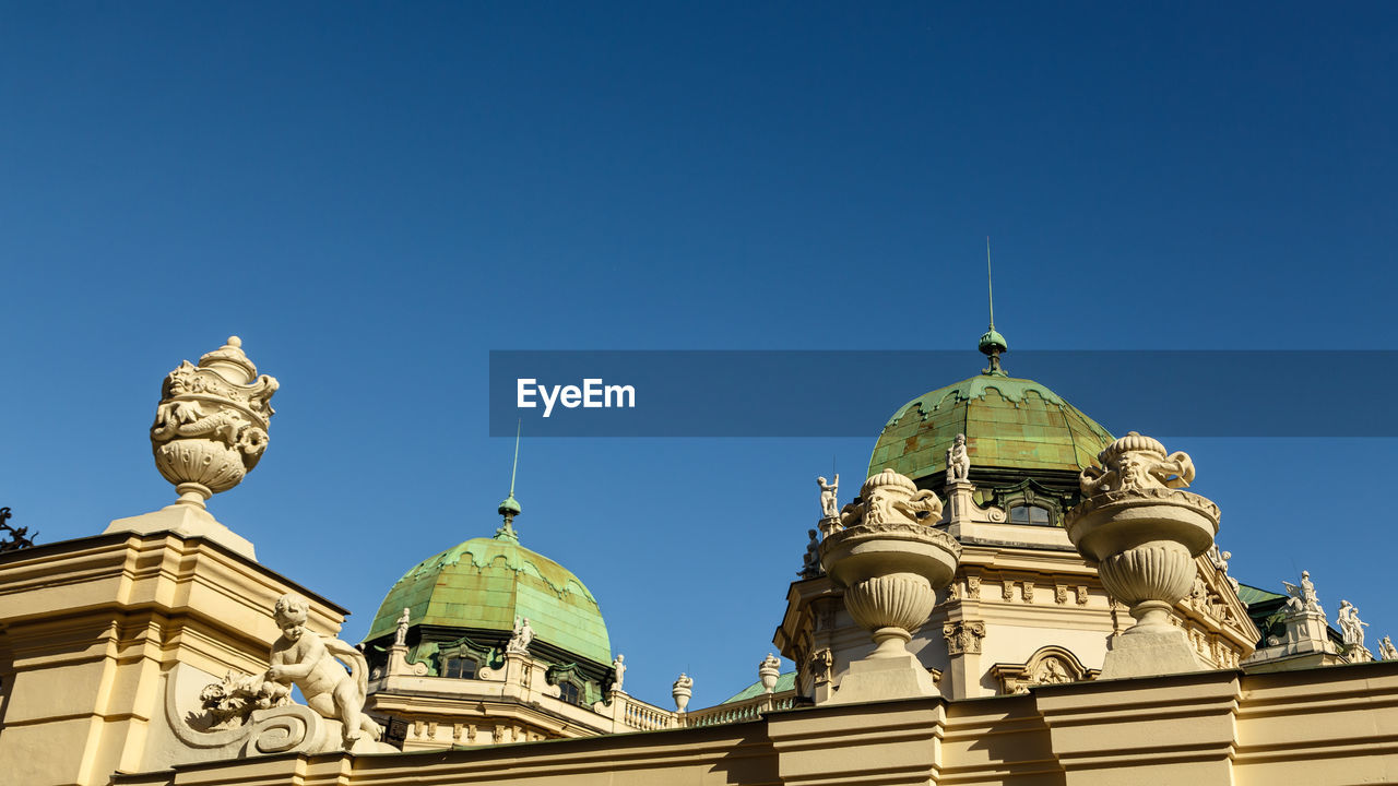 Low angle view of church against clear blue sky