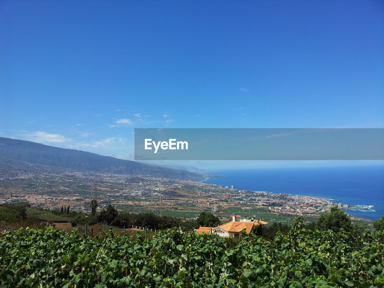 Scenic view of sea against blue sky