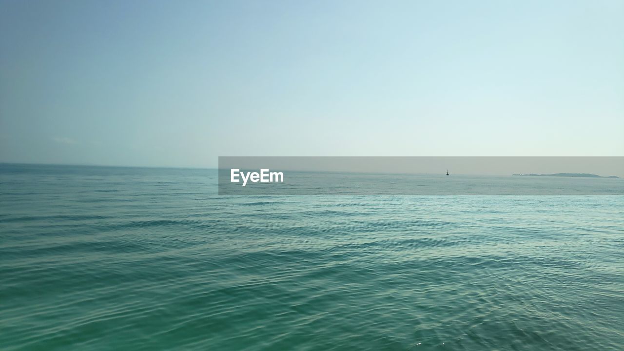 SCENIC VIEW OF SEA AGAINST BLUE SKY