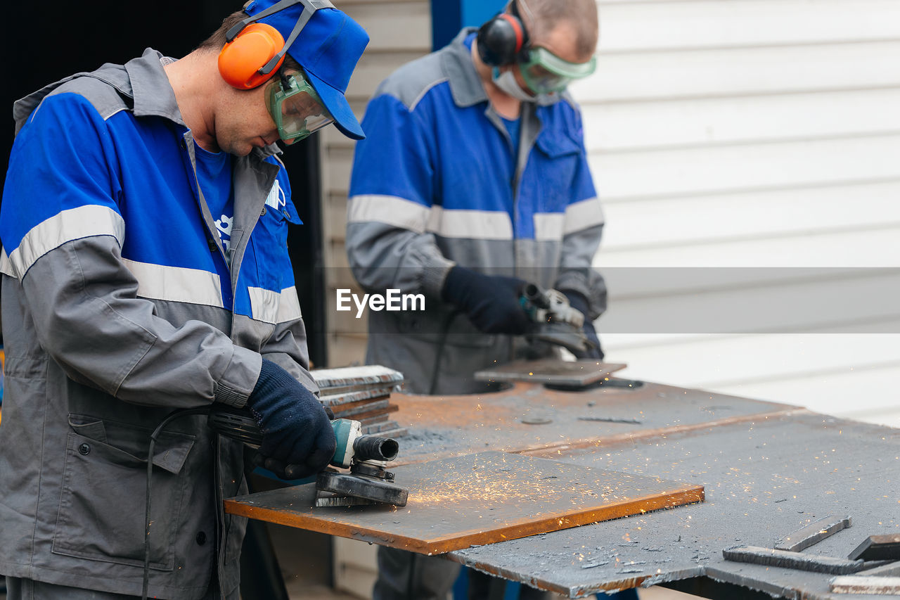 Rear view of man working at workshop