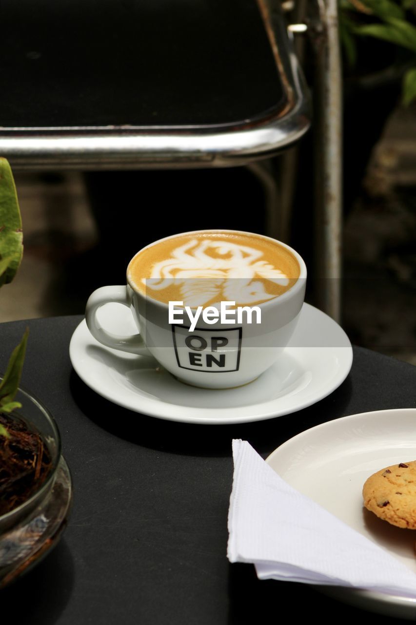 high angle view of coffee in plate on table