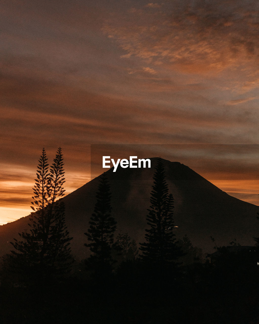 Scenic view of mountains against sky during sunset