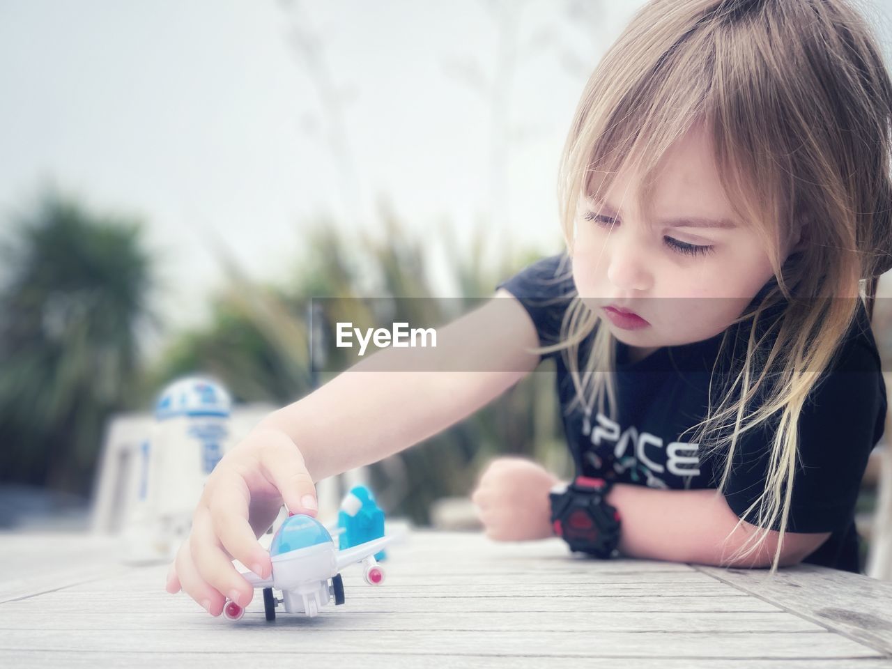 Close-up of cute boy playing with toy on table