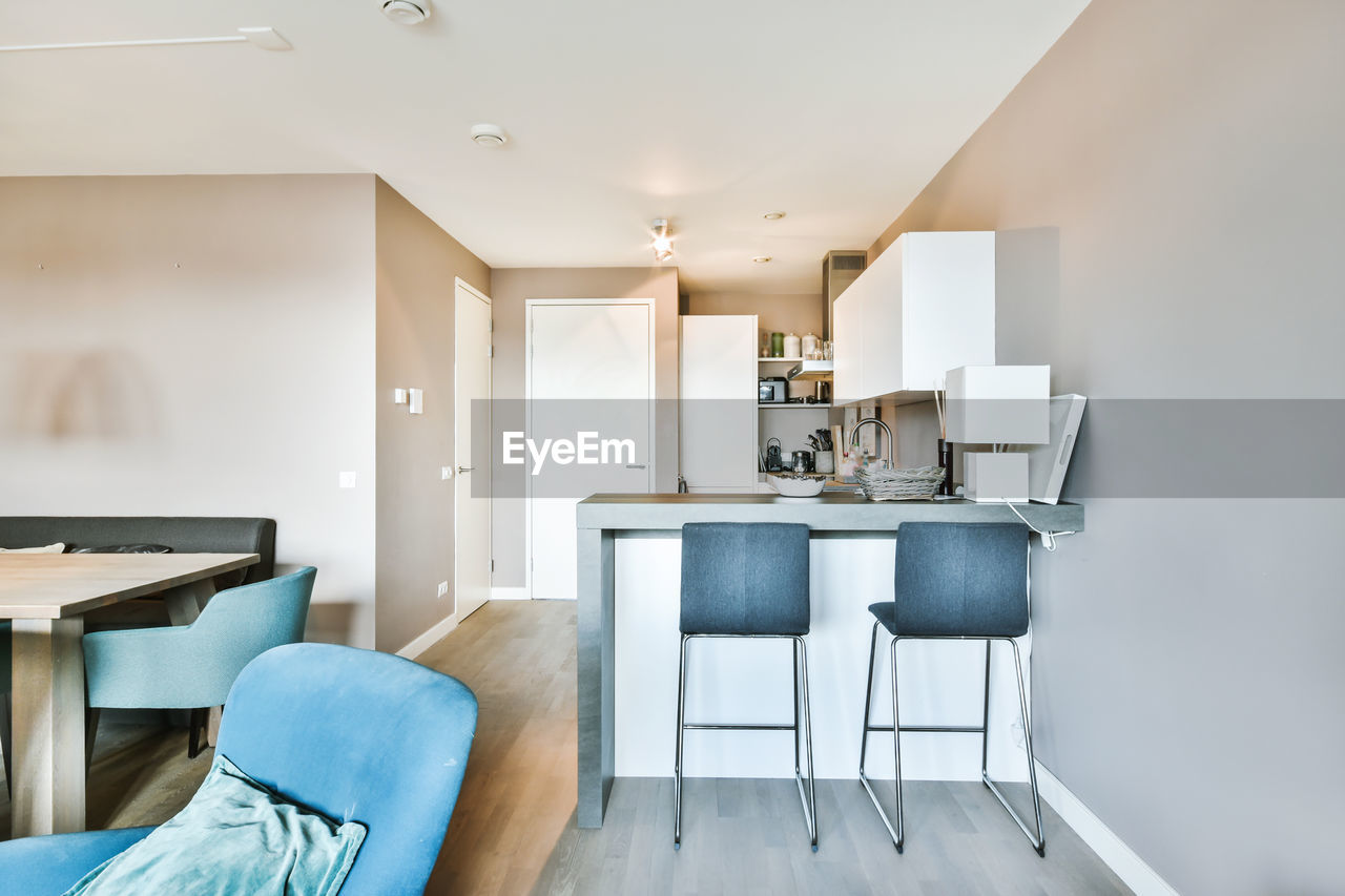 EMPTY CHAIRS AND TABLE IN HOME