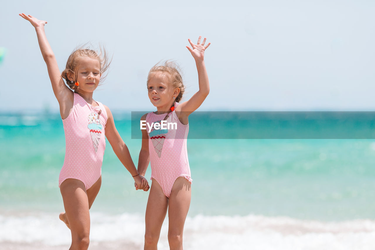 FULL LENGTH OF GIRL ON BEACH