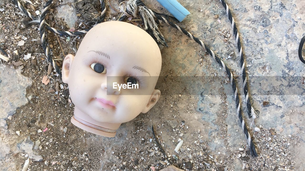 Close-up of broken doll 