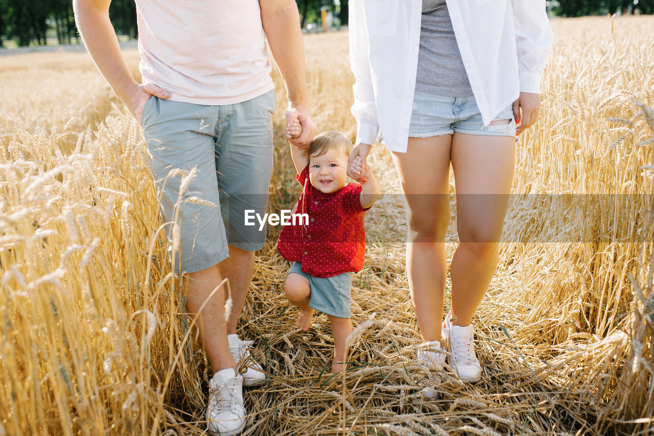 Healthy mother, father and little son enjoy nature together in the fresh air. a happy family 