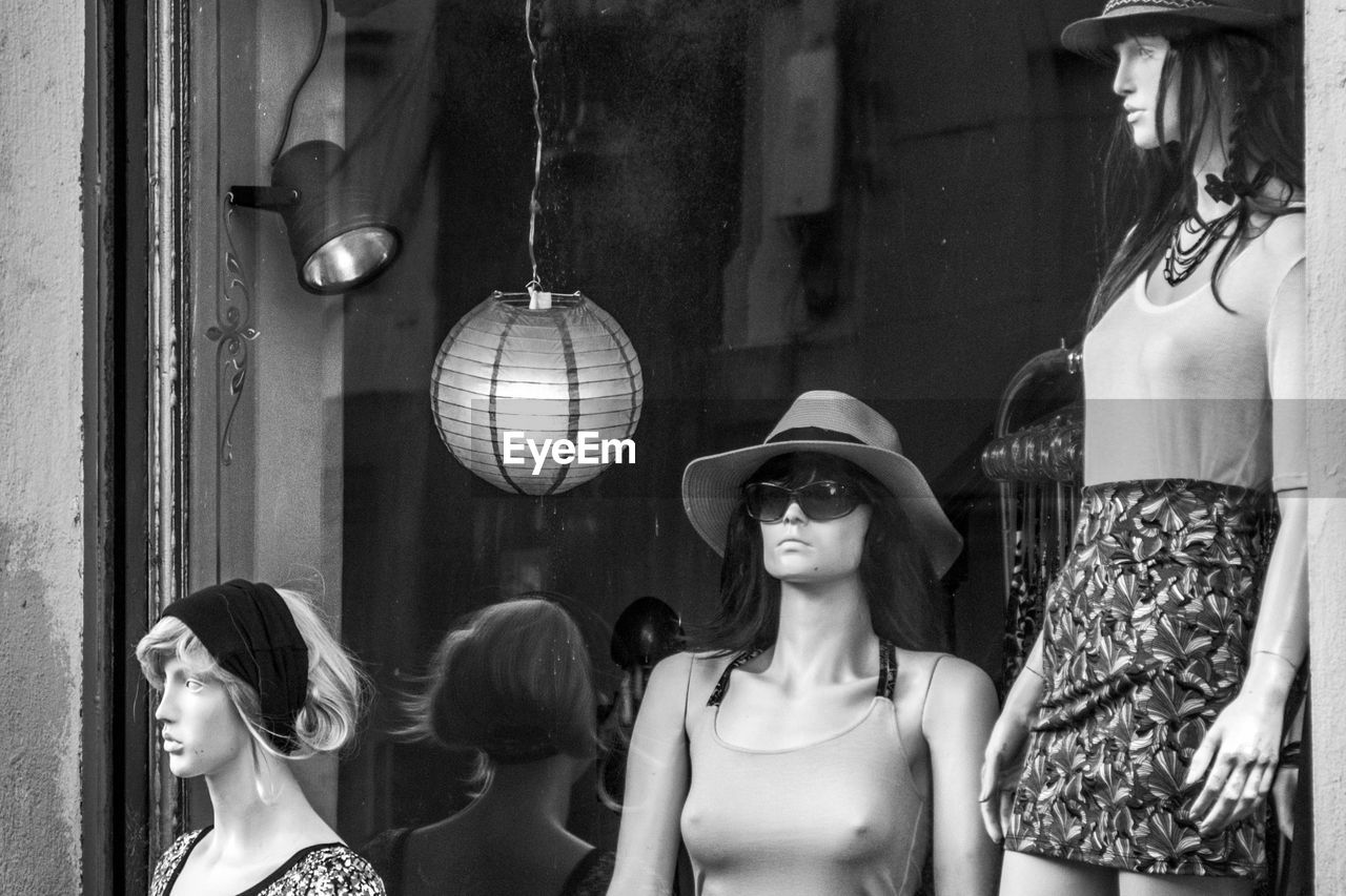 Mannequins displayed outside clothing store