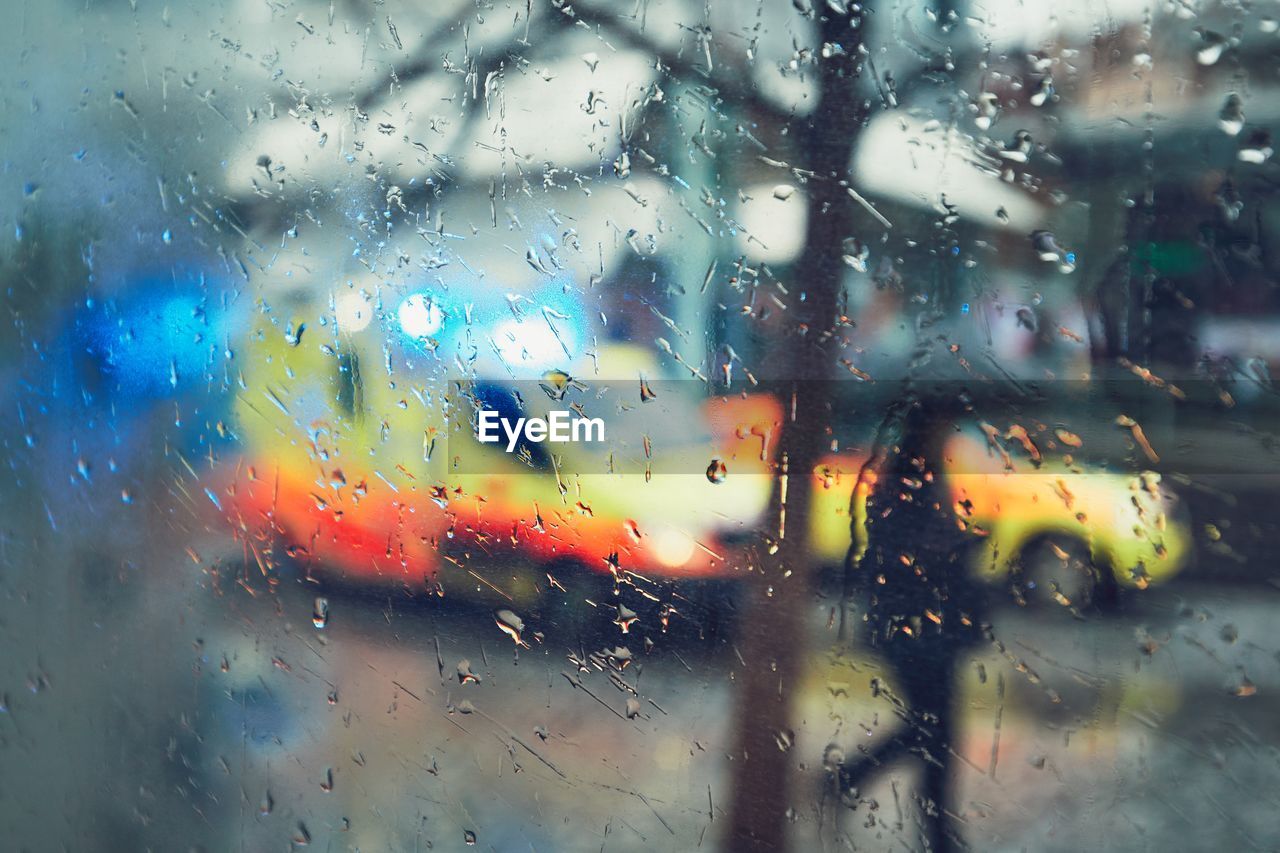 FULL FRAME SHOT OF WET WINDOW IN RAIN