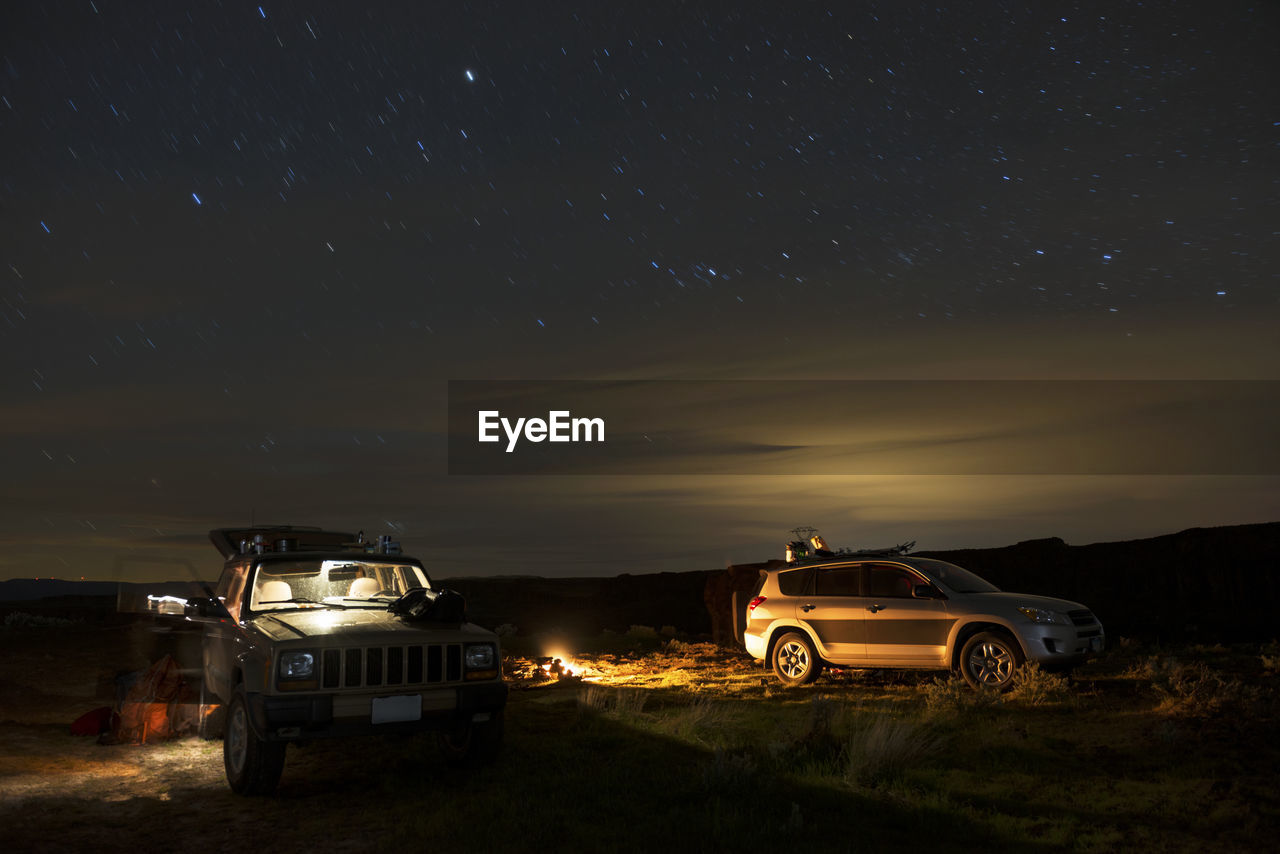 Off-road vehicle and suv at gifford pinchot national forest during night