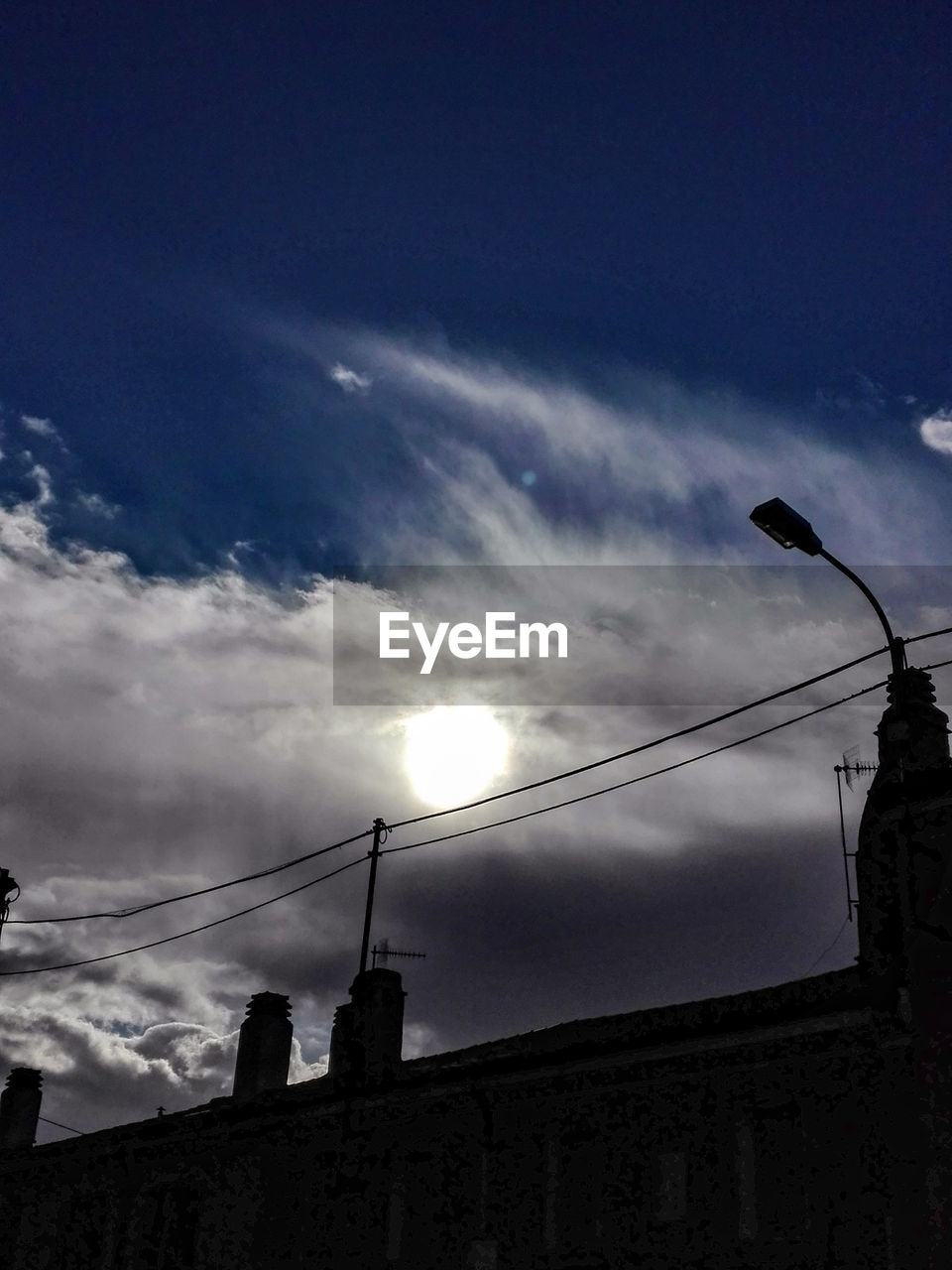 High section of building against cloudy sky