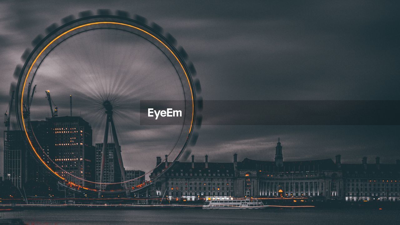 Millennium wheel in city at night