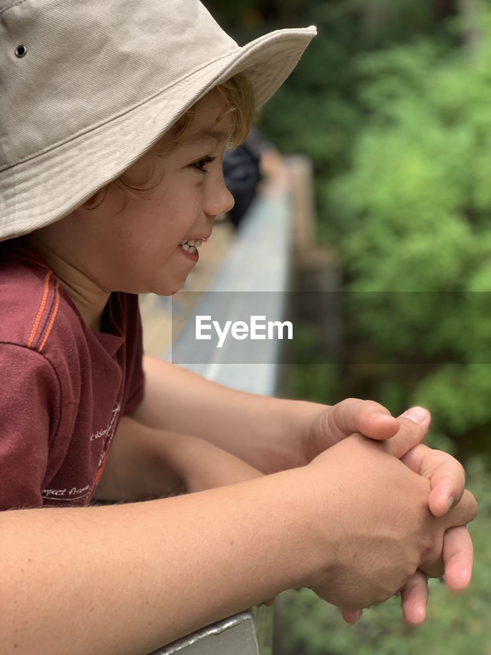 Side view of boy wearing hat