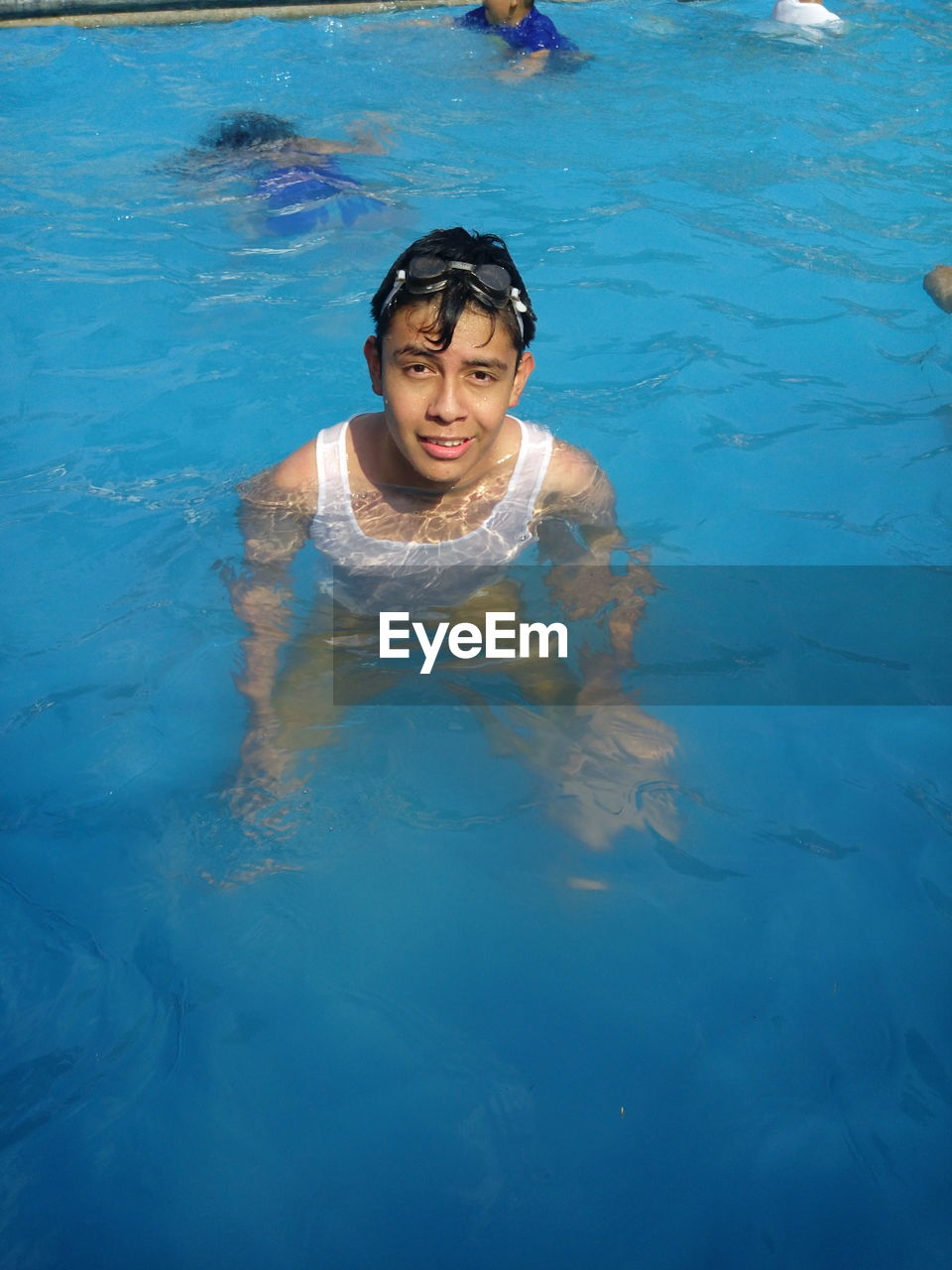 Portrait of teenage boy in swimming pool
