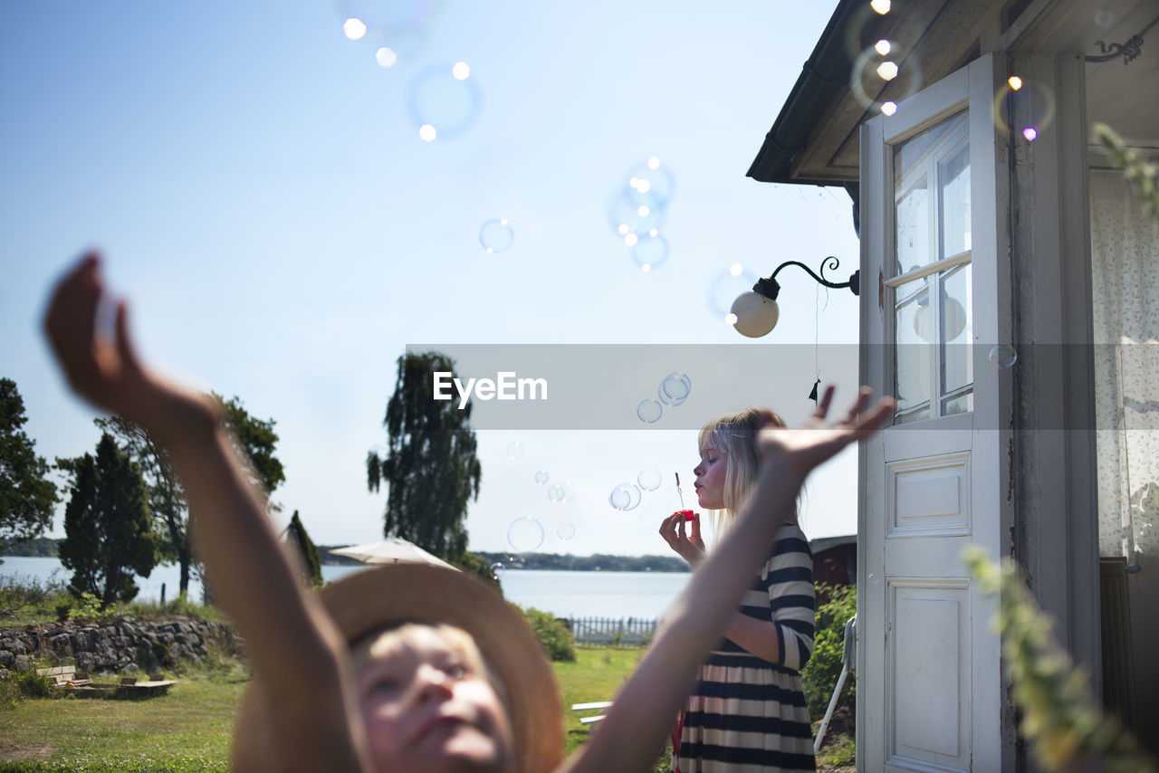 Children playing with soapbubbles