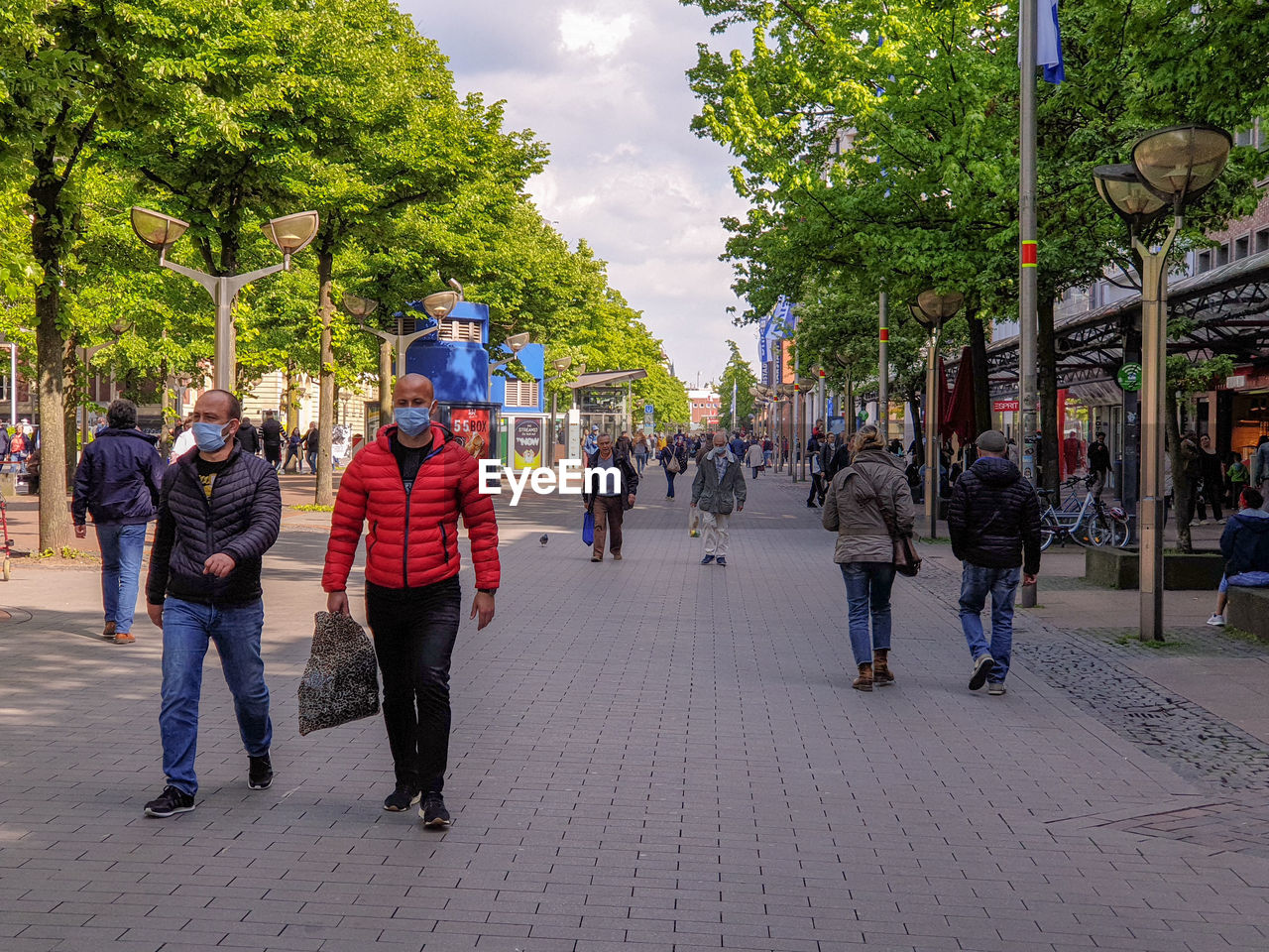 PEOPLE ON STREET IN CITY