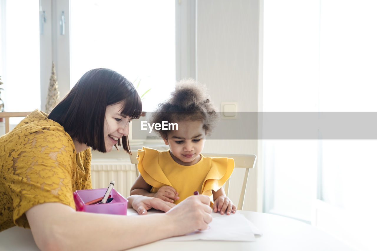 Mother with daughter at home