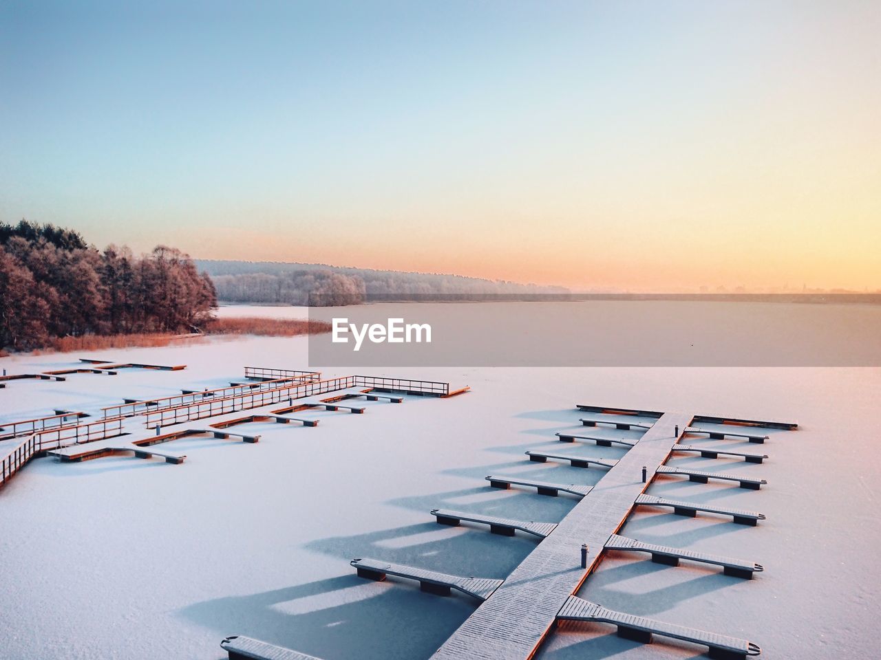 Aerial view of lake against clear sky during winter