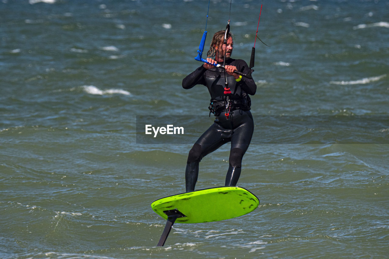 man scuba diving in lake