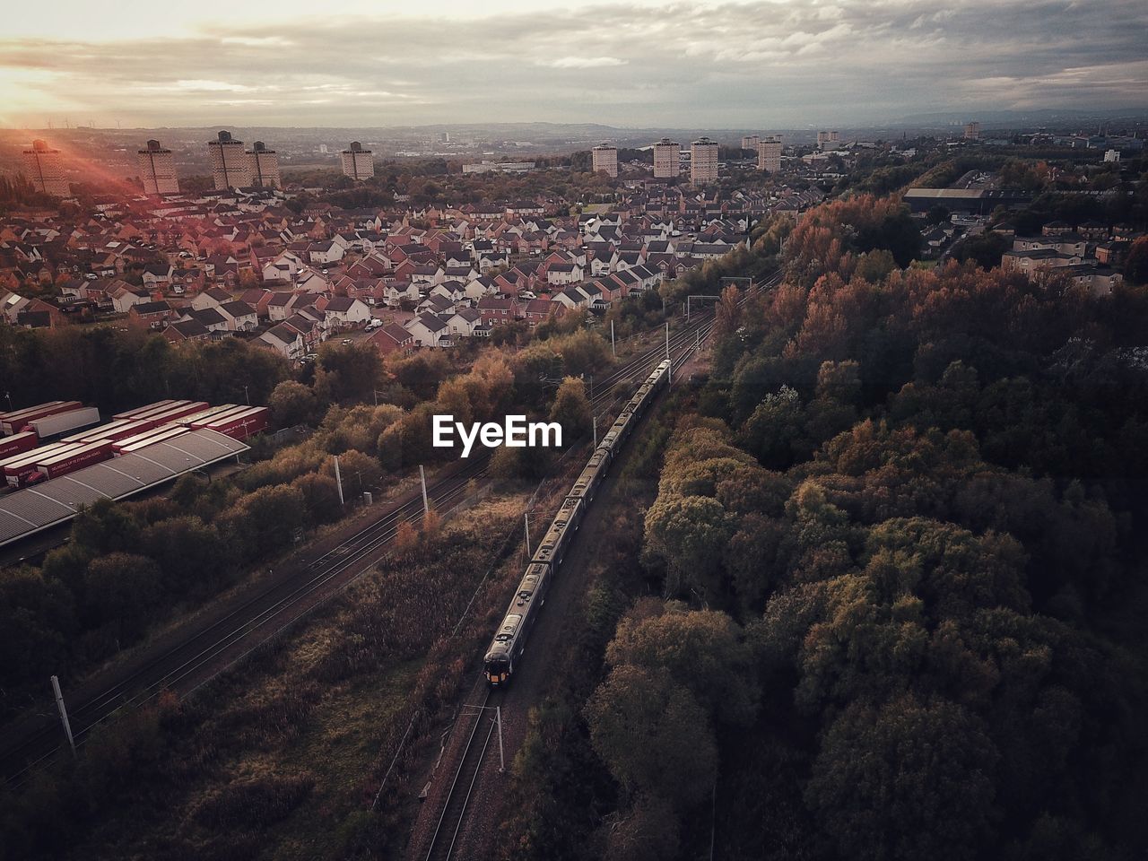 HIGH ANGLE VIEW OF CITY AND BUILDINGS AGAINST SKY