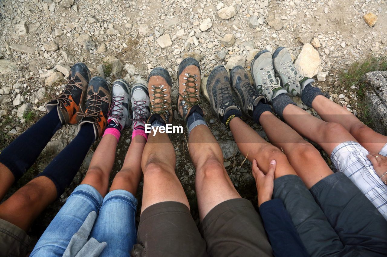 LOW SECTION OF PEOPLE ON HUMAN FEET