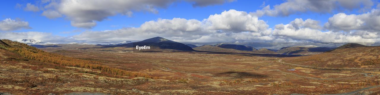 Dovre fjell panorama. This is a huge panorama of Dovre with Snöhetta to the left. The image is 133 megapixel. Clouds And Sky Mountains Mountain Range Mountain No People Scandinavia Orange Color Beauty In Nature Blue Sky White Clouds Fall Colors Scenic Norway Dovre Panorama Snow Capped Mountains