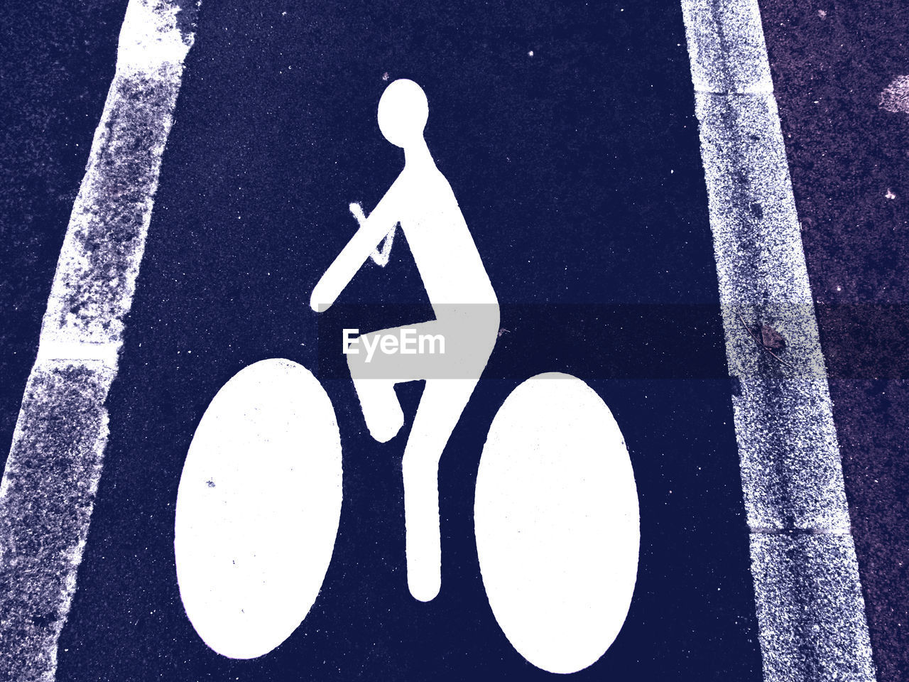 High angle view of bicycle sign on road